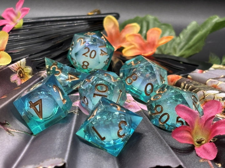 Blue green with white glitter, gold font