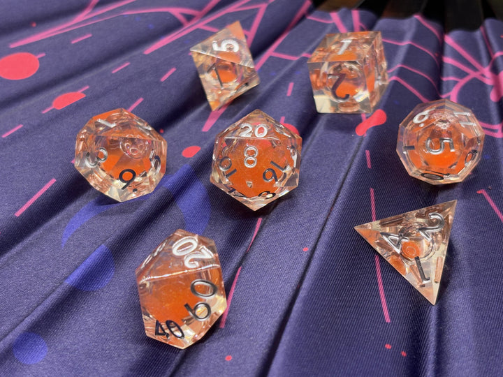 Orange glitter, clear resin, silver font